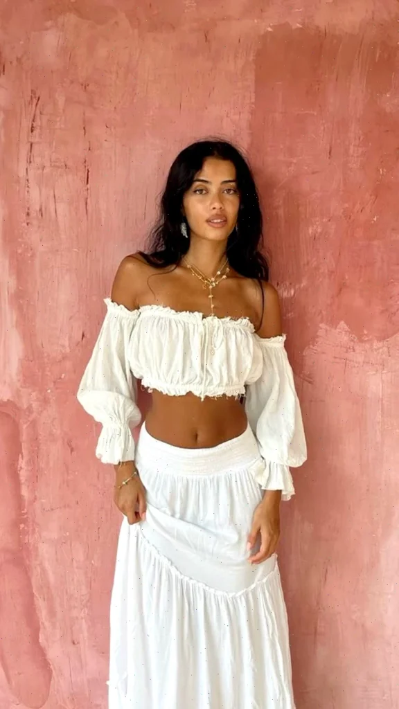 Chloé emerges as 2025’s boho beacon, their buzzworthy collection saturated with free-spirited aesthetics. Beyond the famed organza blouses, summer tops that blend seamlessly with romantic ruffles and sturdy denim abound.