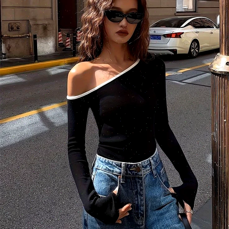 Another incarnation of femininity manifests in the one-shoulder knit top. Yet, caution is advised here: proper undergarments—whether silicone pasties or bandeaus—are paramount to pull off this look gracefully, given its exposure.